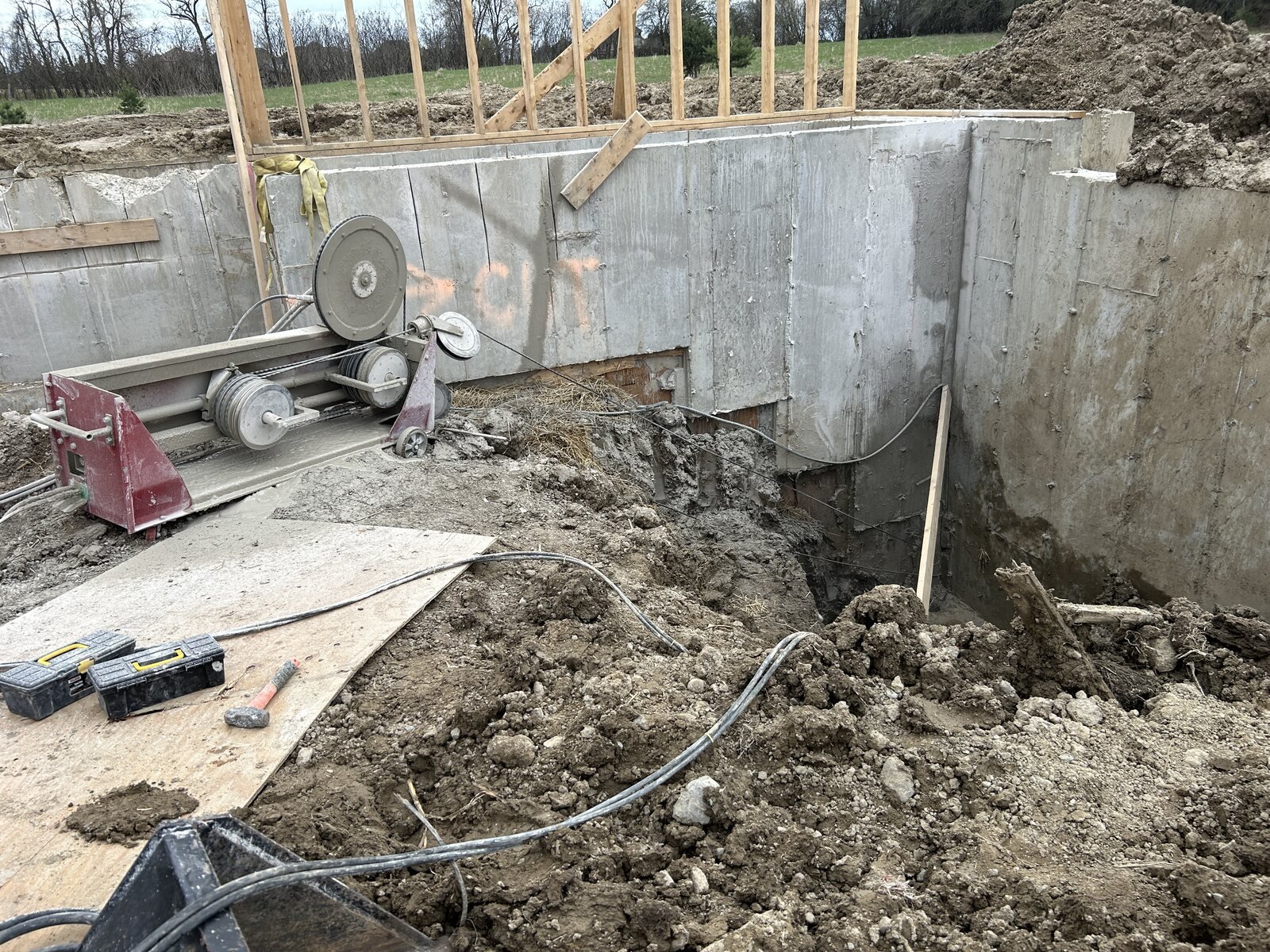 Diamond wire saw cutting a thick reinforced-concrete foundation wall
