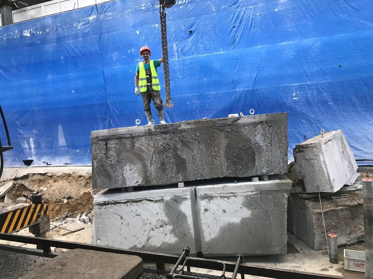 Large cut concrete sections staged for controlled removal